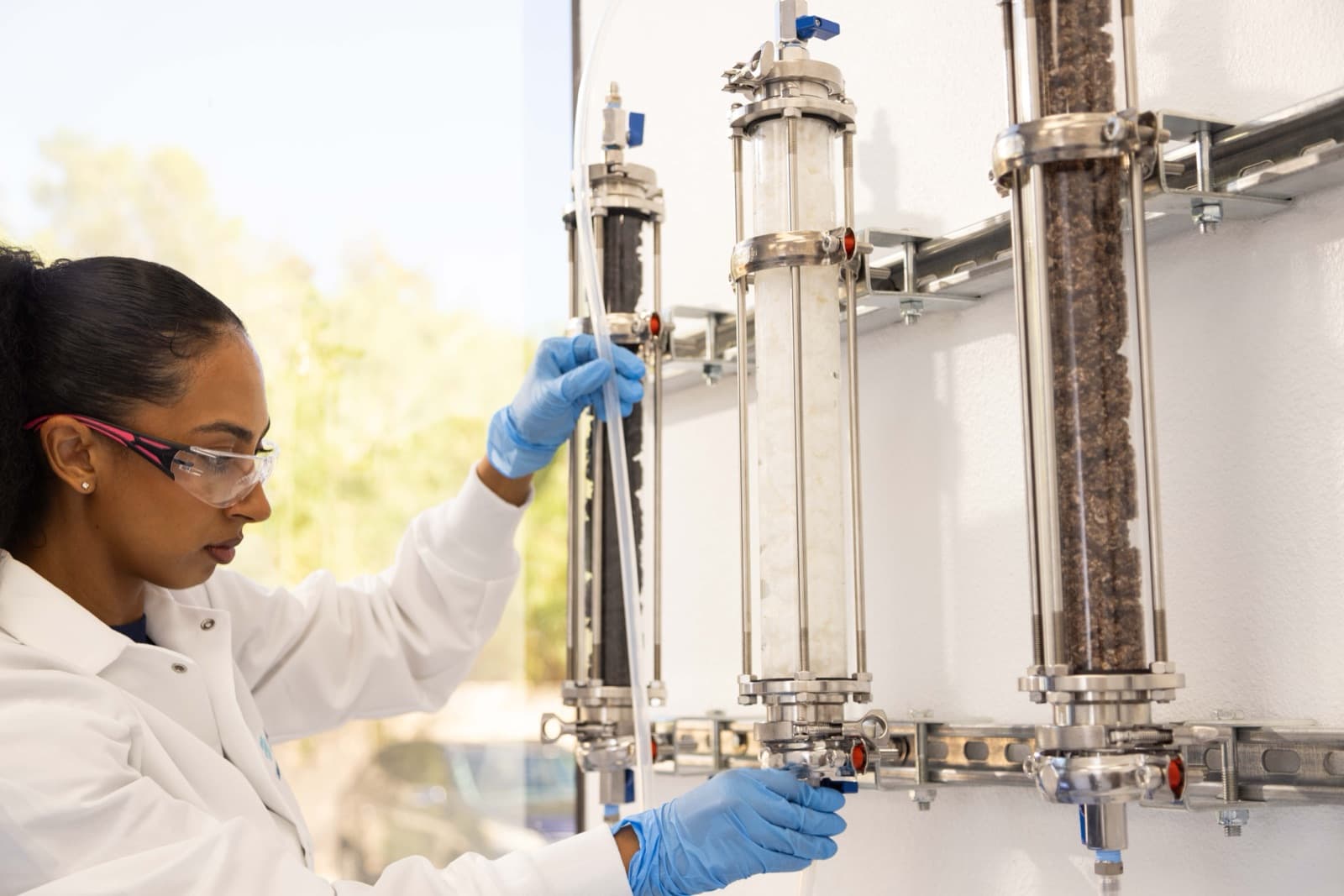 Abtech lab technician adjusting a Smart Sponge test column in the Phoenix lab